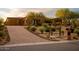 Brick driveway leading to a beautiful, single-story home with desert landscaping at 36482 N Boulder View Dr, Scottsdale, AZ 85262