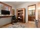 Home office with built-in shelving and adjacent bathroom access at 36482 N Boulder View Dr, Scottsdale, AZ 85262