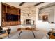Corner fireplace with stone surround and built-in shelving at 36482 N Boulder View Dr, Scottsdale, AZ 85262