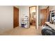 Small office space with built-in shelving and adjacent bathroom at 36482 N Boulder View Dr, Scottsdale, AZ 85262