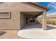 Covered patio with ceiling fan, adjacent to a grassy backyard at 6599 E Casa De Leon Ln, Gold Canyon, AZ 85118