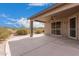 Covered patio with ceiling fan and security doors at 6599 E Casa De Leon Ln, Gold Canyon, AZ 85118