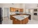 Island kitchen with granite countertops and wood cabinets at 6599 E Casa De Leon Ln, Gold Canyon, AZ 85118