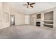 Living room with fireplace and built-in shelving units at 6599 E Casa De Leon Ln, Gold Canyon, AZ 85118