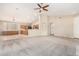 Open kitchen with an island, wood cabinets, and granite countertops at 6599 E Casa De Leon Ln, Gold Canyon, AZ 85118