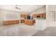 Kitchen boasts an island and ample wood cabinetry at 6599 E Casa De Leon Ln, Gold Canyon, AZ 85118