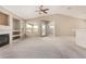 Bright living room featuring a fireplace and built-in shelving at 6599 E Casa De Leon Ln, Gold Canyon, AZ 85118