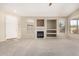 Living area featuring a fireplace and lots of natural light at 6599 E Casa De Leon Ln, Gold Canyon, AZ 85118