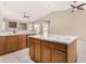 Island kitchen with granite countertop and wood cabinetry at 6599 E Casa De Leon Ln, Gold Canyon, AZ 85118