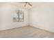 Spacious bedroom featuring a large window and ceiling fan at 6599 E Casa De Leon Ln, Gold Canyon, AZ 85118