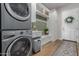 Bright laundry room with washer, dryer, and built-in storage at 33632 N Rifleman Rd, Cave Creek, AZ 85331