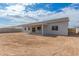 Back exterior view showing a single-story home with covered patio at 35075 N Palm Dr, San Tan Valley, AZ 85140