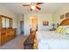 Main bedroom with large bed and bay window at 20340 N Canyon Whisper Dr, Surprise, AZ 85387