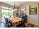 Dining area with backyard access and view into living room at 20340 N Canyon Whisper Dr, Surprise, AZ 85387