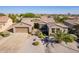 Single-story home with two-car garage and desert landscaping at 20340 N Canyon Whisper Dr, Surprise, AZ 85387