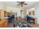 Home office with two desks and built-in shelving at 20340 N Canyon Whisper Dr, Surprise, AZ 85387