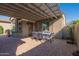 Covered patio with pergola, outdoor dining set, and backyard view at 20340 N Canyon Whisper Dr, Surprise, AZ 85387