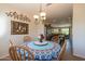 Bright dining area with a table set for four and a chandelier at 20340 N Canyon Whisper Dr, Surprise, AZ 85387