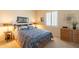 Cozy bedroom with a queen-size bed, nightstands, and dresser at 20340 N Canyon Whisper Dr, Surprise, AZ 85387