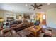 Open living room with a view of the kitchen and entryway at 20340 N Canyon Whisper Dr, Surprise, AZ 85387