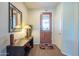 Bright entryway with wood flooring and a decorative mirror at 20340 N Canyon Whisper Dr, Surprise, AZ 85387