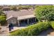 Spacious backyard with patio, seating area, and mature trees at 20340 N Canyon Whisper Dr, Surprise, AZ 85387
