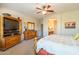 Main bedroom with dresser and large TV at 20340 N Canyon Whisper Dr, Surprise, AZ 85387