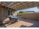 Covered patio with pergola, dining table, and comfortable seating at 20340 N Canyon Whisper Dr, Surprise, AZ 85387