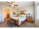Main bedroom with king bed and access to the bathroom at 20340 N Canyon Whisper Dr, Surprise, AZ 85387