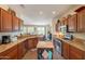 Open kitchen with granite counters, stainless steel appliances, and island at 20340 N Canyon Whisper Dr, Surprise, AZ 85387
