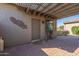 Private patio with pergola, bike, and decorative wall art at 20340 N Canyon Whisper Dr, Surprise, AZ 85387
