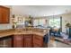 Open kitchen with granite countertops and breakfast bar at 20340 N Canyon Whisper Dr, Surprise, AZ 85387