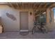 Private patio with pergola, bike, and decorative wall art at 20340 N Canyon Whisper Dr, Surprise, AZ 85387