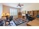 Bright home office with built-in shelving and two desks at 20340 N Canyon Whisper Dr, Surprise, AZ 85387