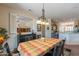 Bright dining room with a view into the kitchen and access to the backyard at 20340 N Canyon Whisper Dr, Surprise, AZ 85387