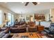 Relaxing living room with leather furniture and access to patio at 20340 N Canyon Whisper Dr, Surprise, AZ 85387