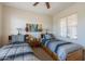 Cozy bedroom with two twin beds and large window at 20340 N Canyon Whisper Dr, Surprise, AZ 85387