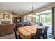 Dining room with view of living room, kitchen and sliding door to patio at 20340 N Canyon Whisper Dr, Surprise, AZ 85387