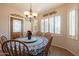 Charming dining area with table, chairs, and decorative wall art at 20340 N Canyon Whisper Dr, Surprise, AZ 85387