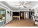 Living room with a view of the backyard and built-in shelving at 3425 W Acoma Dr, Phoenix, AZ 85053