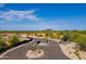 Community entrance with a modern design and desert landscaping at 10610 E Stoney Cir, Scottsdale, AZ 85262