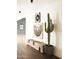 Bright hallway with unique bench and large cactus at 10610 E Stoney Cir, Scottsdale, AZ 85262