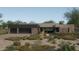 Stunning contemporary home with landscaped desert front yard at 10610 E Stoney Cir, Scottsdale, AZ 85262