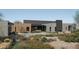 Luxury backyard oasis featuring a modern pool and desert landscaping at 10610 E Stoney Cir, Scottsdale, AZ 85262