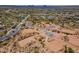 Aerial view of a luxury community with multiple homes and desert landscape at 10610 E Stoney Cir, Scottsdale, AZ 85262