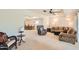 Spacious living room with comfortable seating and view to dining area at 13605 N Redwood Dr, Sun City, AZ 85351