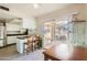 Kitchen with island seating, patio access, and built-in shelving at 13605 N Redwood Dr, Sun City, AZ 85351