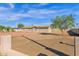 Single story home with large gravel front yard and tree at 2802 W Adams St, Phoenix, AZ 85009