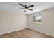 Bright bedroom with ceiling fan and wood-look flooring at 2802 W Adams St, Phoenix, AZ 85009