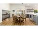 Kitchen dining area with round table and chairs, overlooking pool at 7329 N 173Rd Ave, Waddell, AZ 85355